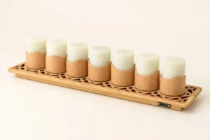 A 7-pack set of rechargeable flameless candles on a carved bamboo charging dock with a Type-C port, featuring magnetic pods, offering up to 30-hour and 48-hour runtime versions.