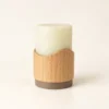 A single rechargeable flameless candle featuring a silicone light core mounted on a beech wood pod with a built-in backup battery, offering up to 30-hour and 48-hour runtime versions.