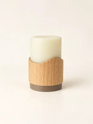 A single rechargeable flameless candle featuring a silicone light core mounted on a beech wood pod with a built-in backup battery, offering up to 30-hour and 48-hour runtime versions.